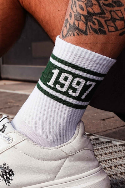 Close-up of white and green men's cotton socks – 1997 retro print detail on soft breathable fabric
