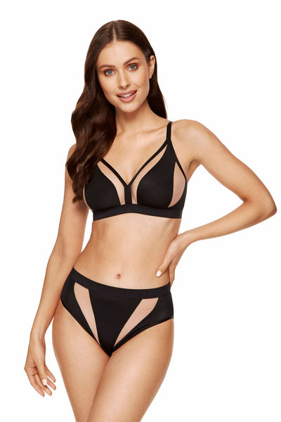 Model wearing the Merida black wireless soft bra with the matching mesh-panel brief.