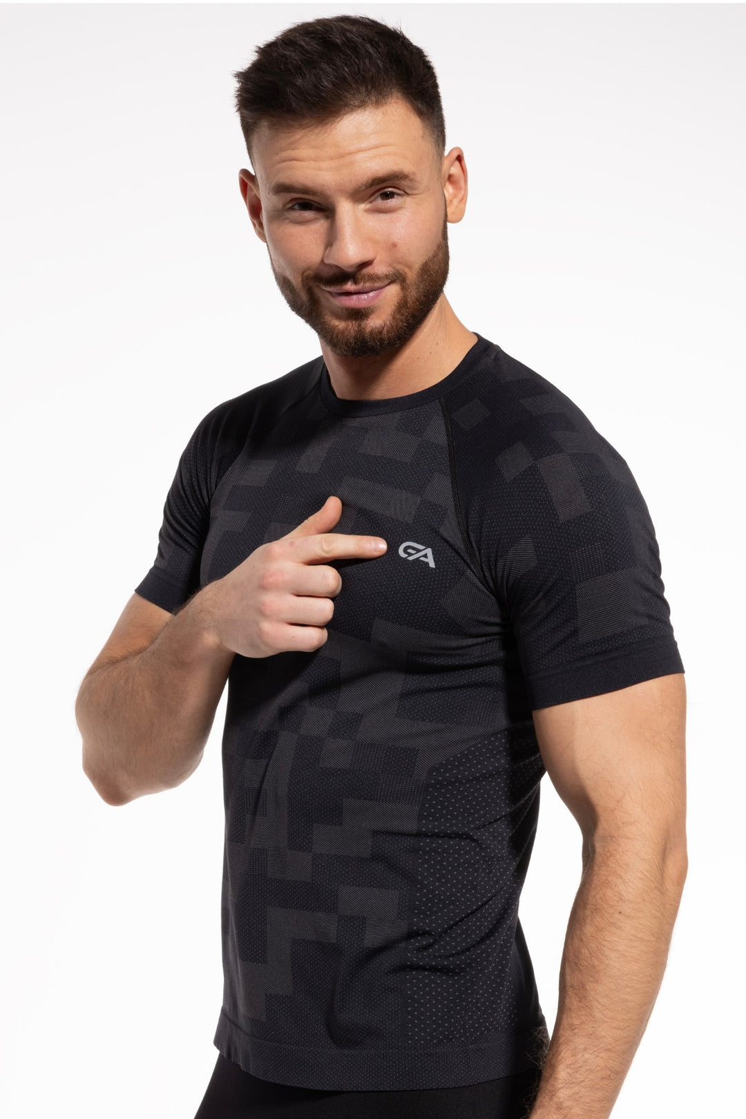 Model wearing black and graphite active T-shirt with athletic fit and moisture-wicking fabric, ideal for high-intensity workouts and training