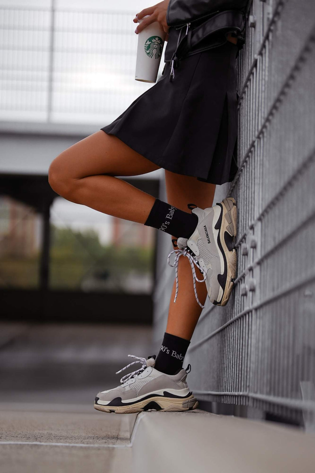Black cotton socks with "90's Baby" text print – side view showing slogan and ankle fit
