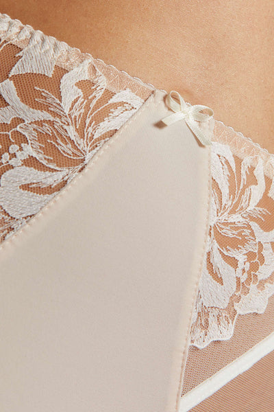 Close-up of the Egerie panty's satin front panel, ivory lace sides and a small ivory bow.