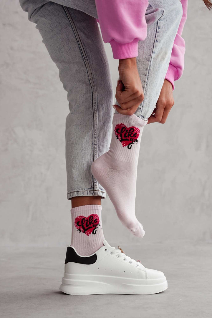 Powder pink cotton socks with "I Like You" text print – side view showing slogan and ankle fit

