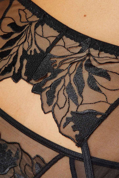 Close-up of the Coco garter belt's black leaf embroidery worked on fine sheer mesh.