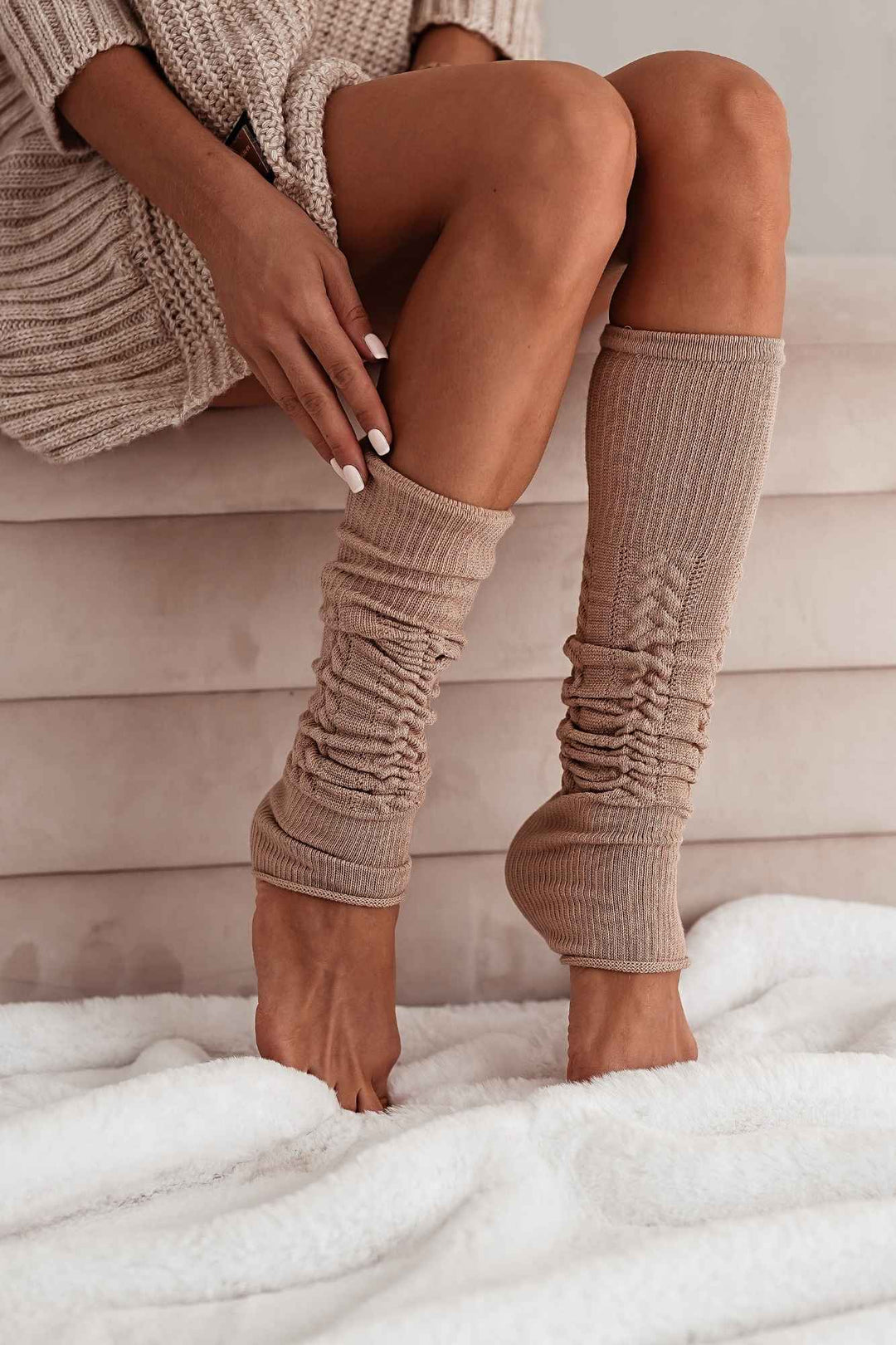 Beige cotton openwork leg warmers for women – side view showing knit texture and full length
