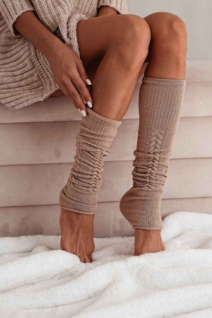 Beige cotton openwork leg warmers for women – side view showing knit texture and full length

