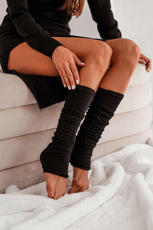 Black cotton openwork leg warmers for women – side view showing knit texture and full length

