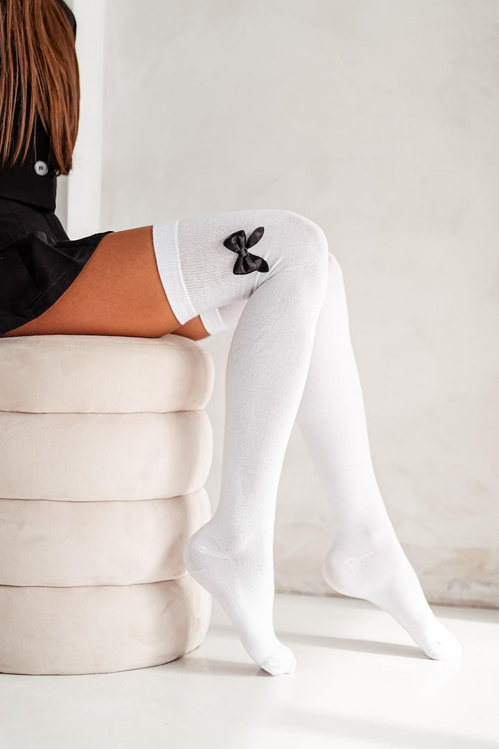 White cotton over-knee socks with bow – side view showing bow detail and full length
