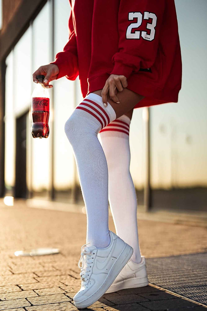 White and red cotton over-knee socks with striped welt – side view showing stripe detail and full length
