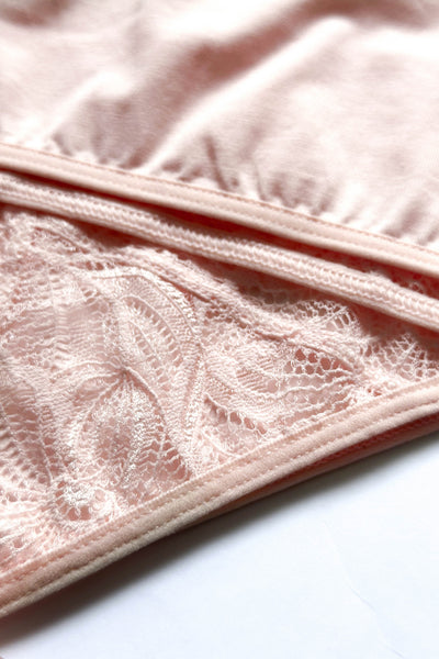 Close-up of the Emilia pink cotton brief, showing the floral lace panel and bound edge.