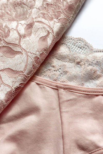 Emilia pink cotton brief folded to show the soft jersey beside its floral lace back.