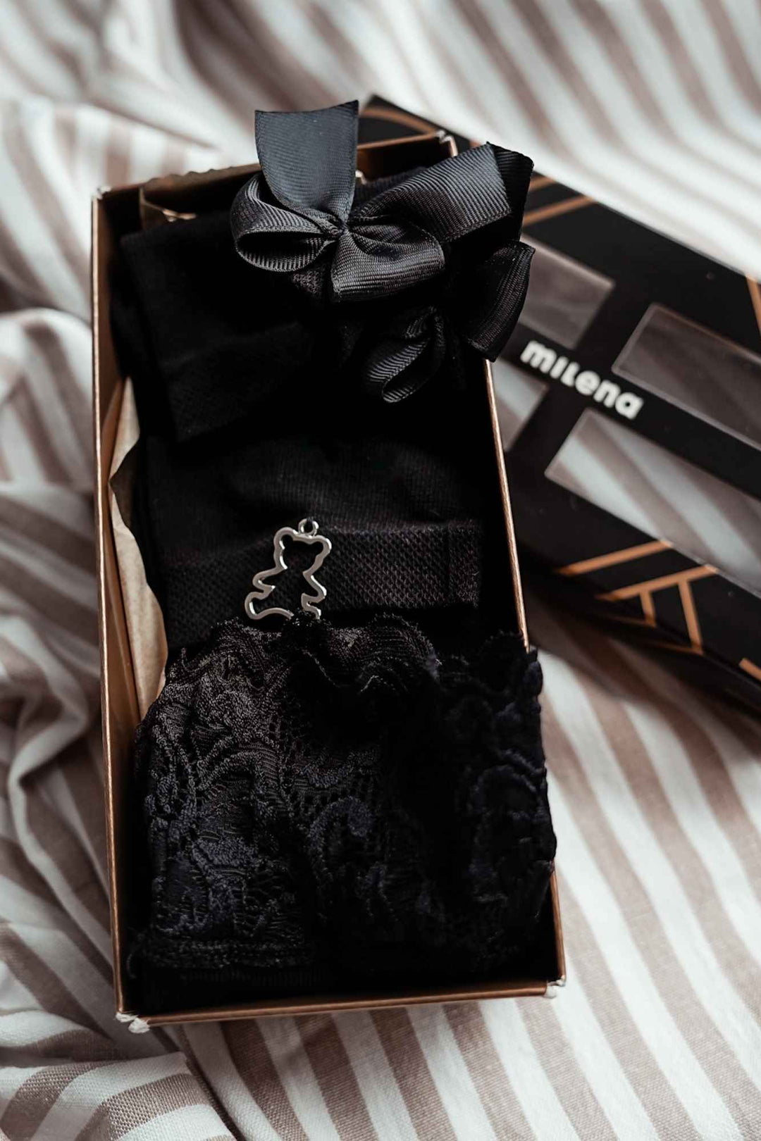 Close-up of women's exclusive black cotton sock gift set – detail view of embellishments and finish
