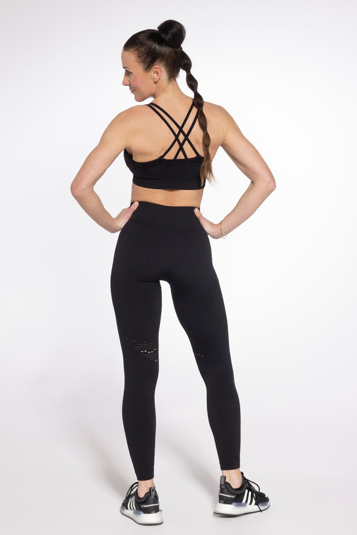 Seamless black sports bra front view alternative angle