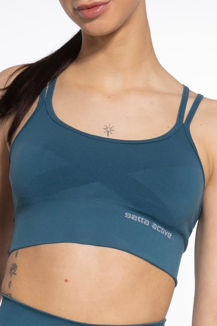 Close-up of seamless fabric and cup structure on Gatta Active bra in noble green
