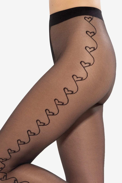 Close-up of connected hearts pattern on GATTA Lovely 20 DEN sheer black tights
