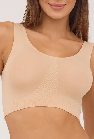 Gatta seamless sports top in beige, front view with wide straps and a scoop neck.