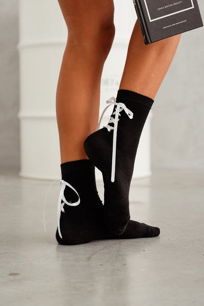 Black lace-trim cotton socks – side view showing lace edge, ribbon detail and ankle fit
