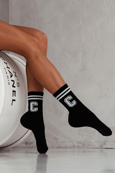 White and black cotton socks with letter C print – side view showing initial pattern and ankle fit

