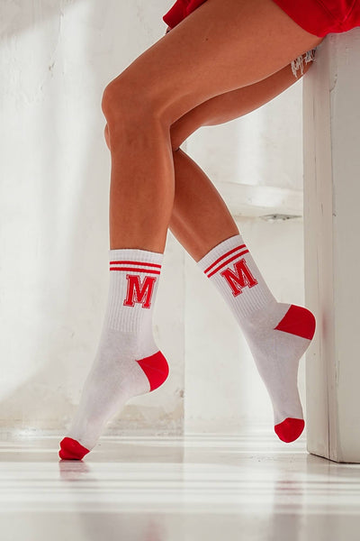 White cotton socks with red letter M print – side view showing initial pattern and ankle fit

