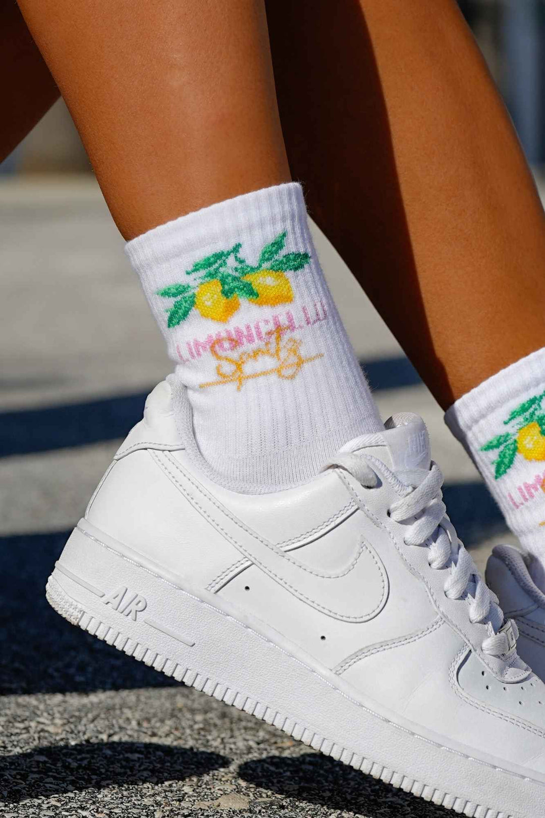 Close-up of white Limoncello cotton socks – lettering detail on soft breathable fabric
