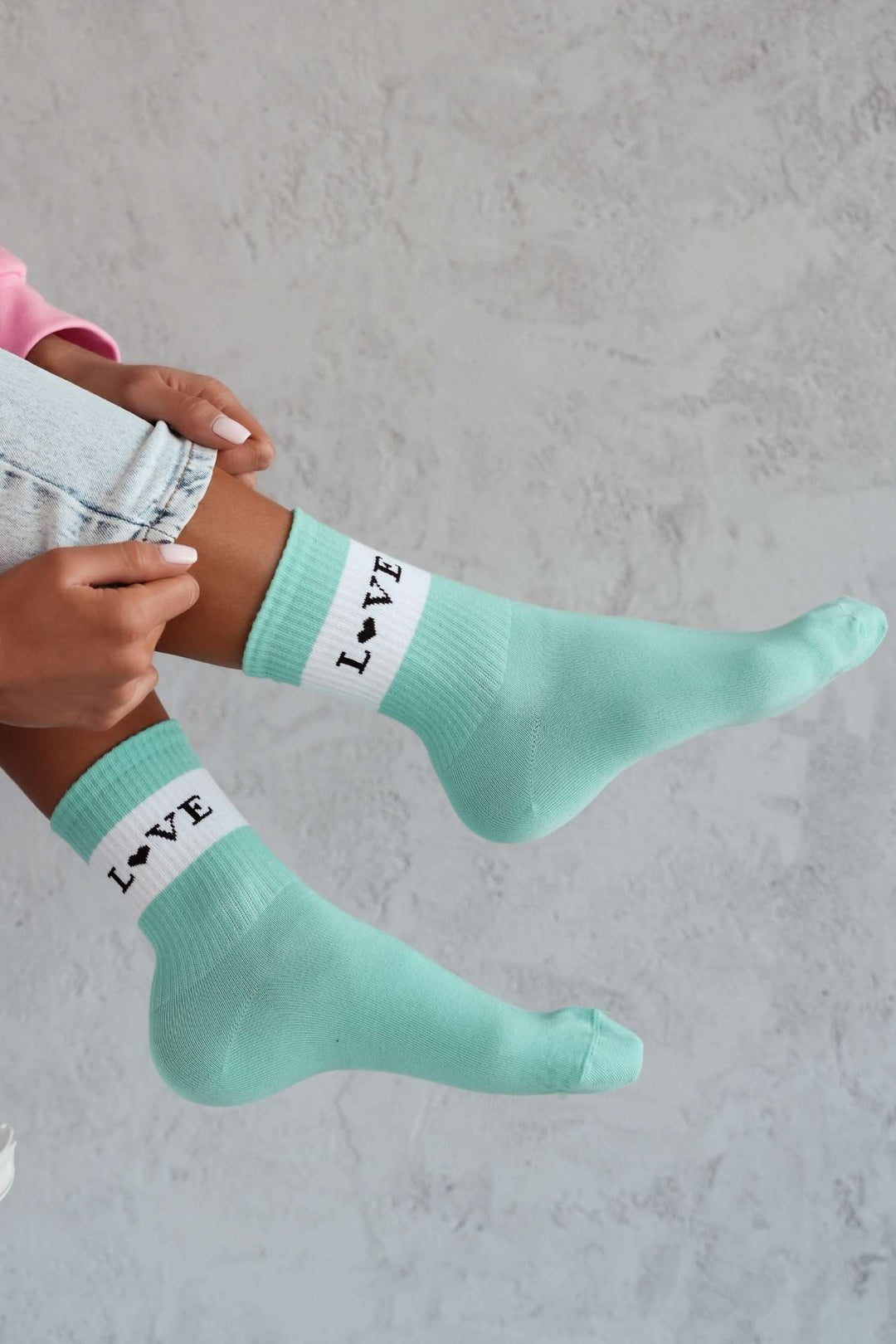 Mint cotton socks with "Love" text print – side view showing slogan and ankle fit
