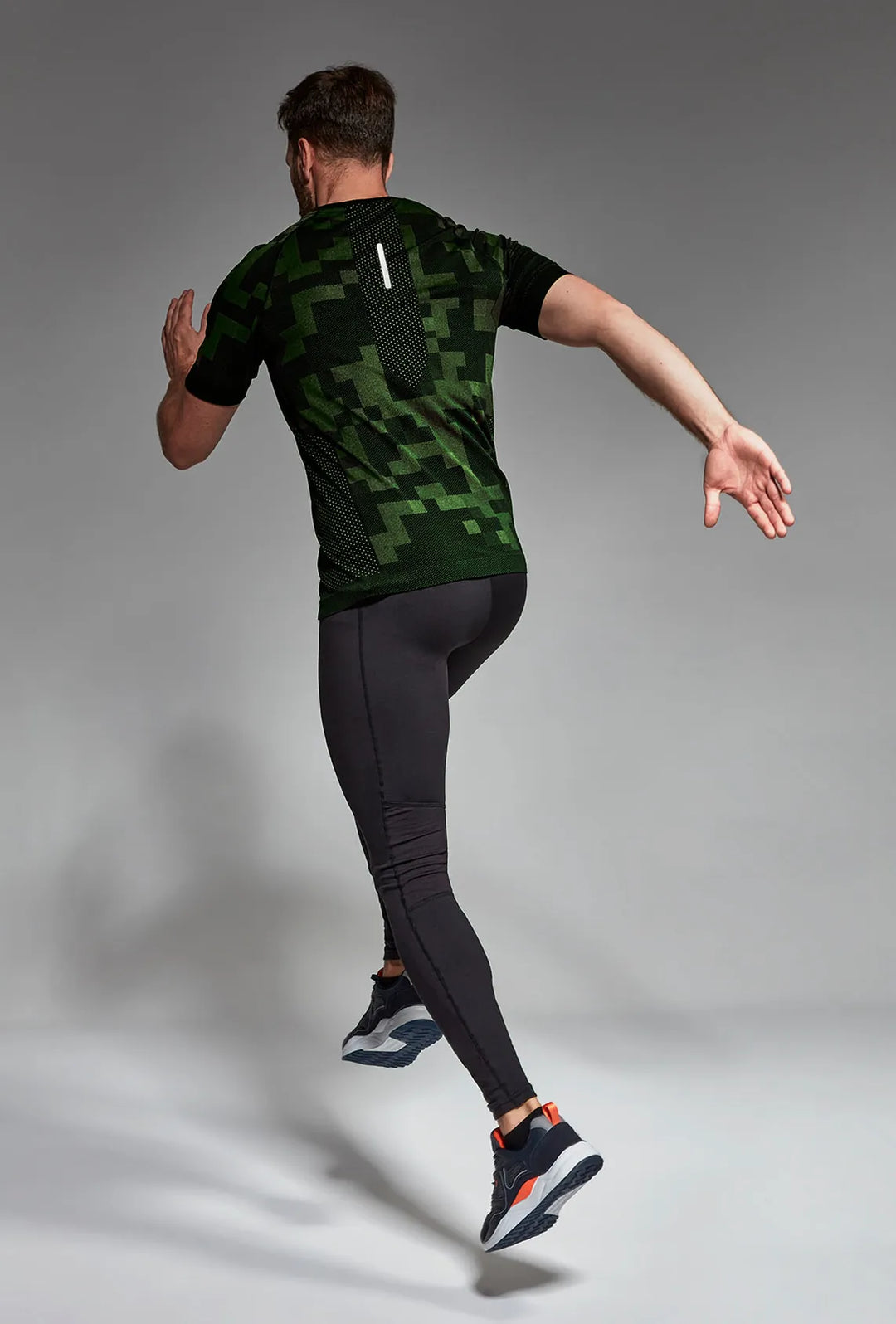 Black green men's activewear T-shirt back view, full length
