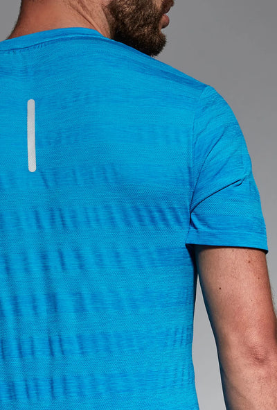 Blue men's sports top close-up, reflective element detail
