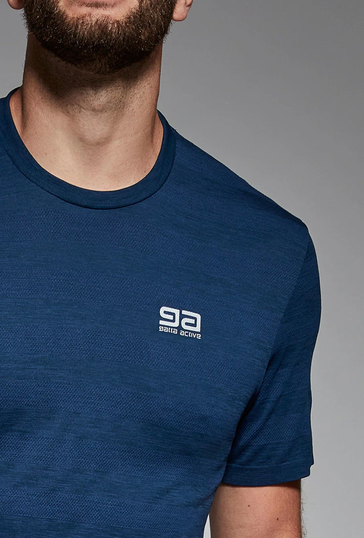 Navy blue training top close-up, reflective detail visible
