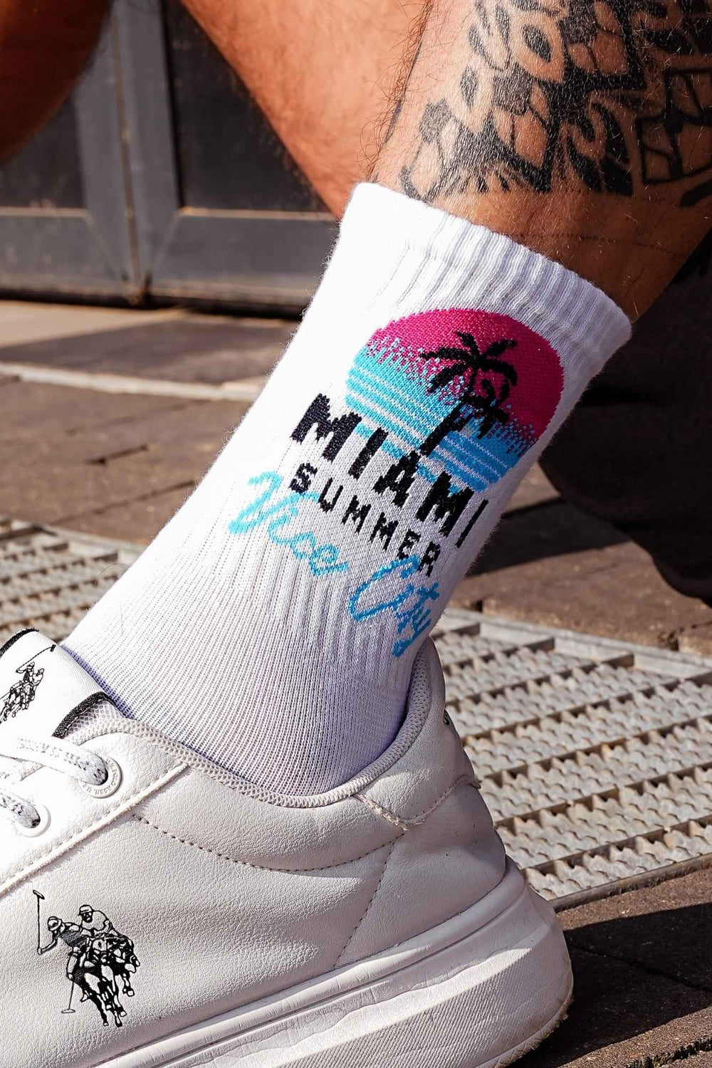 Close-up of white men's cotton socks – Miami Vice City tropical print detail on soft breathable fabric
