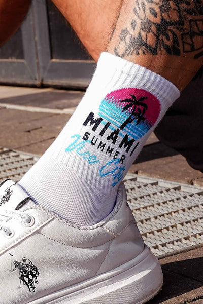 Close-up of white men's cotton socks – Miami Vice City tropical print detail on soft breathable fabric
