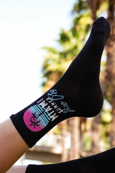 Close-up of black Miami Vice City cotton socks – retro print detail on soft breathable fabric
