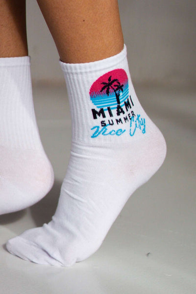 Close-up of white Miami Vice City cotton socks – retro print detail on soft breathable fabric
