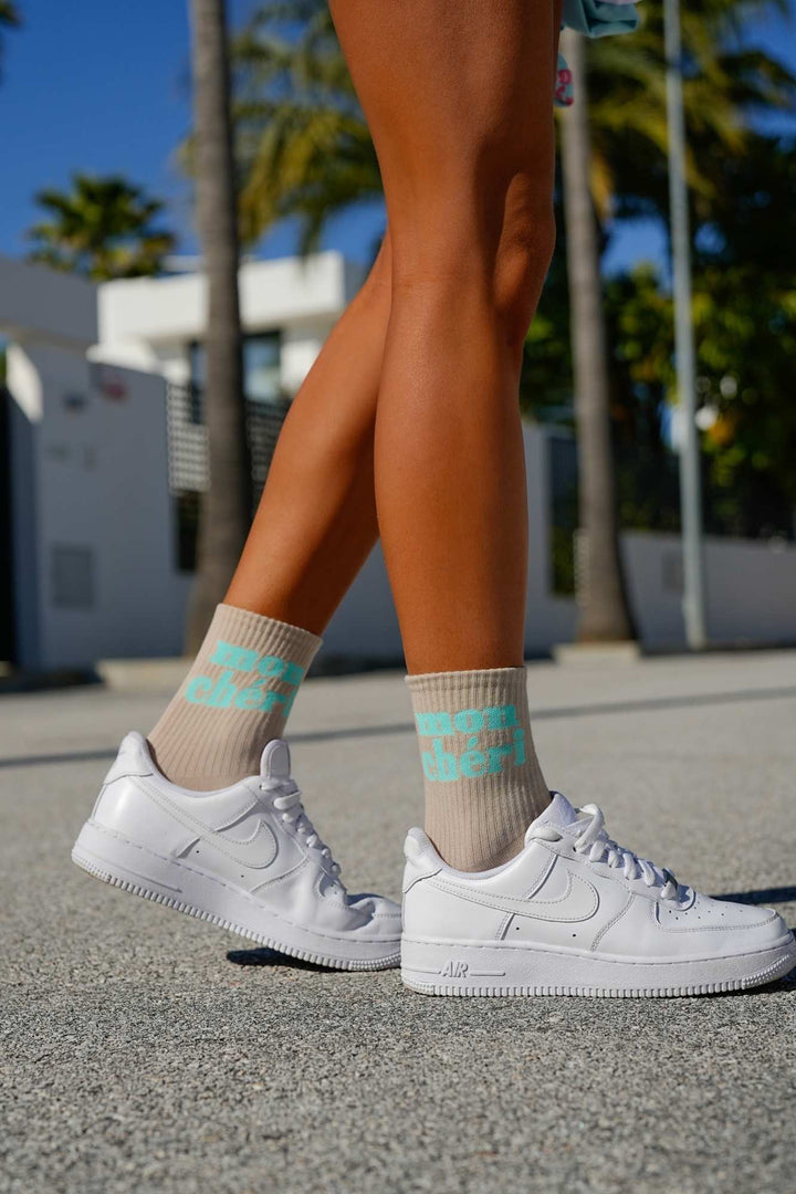 Beige Mon Chéri cotton socks – second side angle showing text print and ankle fit
