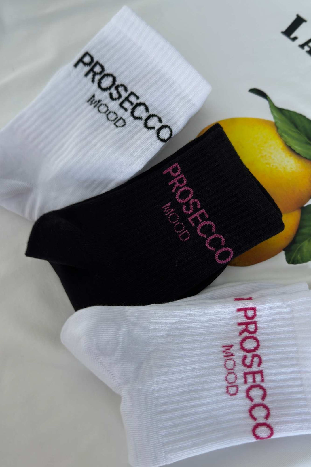 Prosecco Mood cotton socks in black, white-pink and white-black – all three colourways shown together
