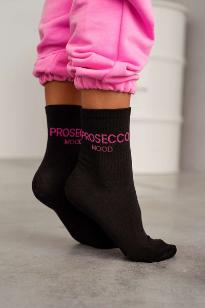 Black cotton socks with Prosecco Mood text print – side view showing pattern and ankle fit
