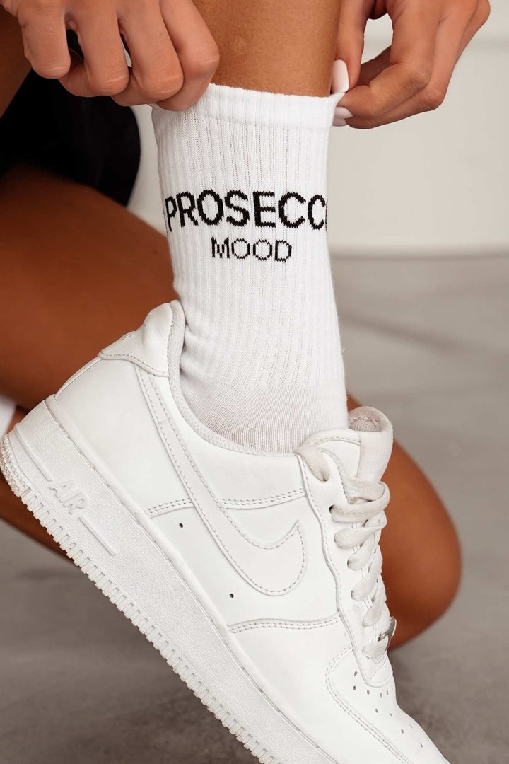Close-up of white and black Prosecco Mood cotton socks – lettering detail on soft breathable fabric
