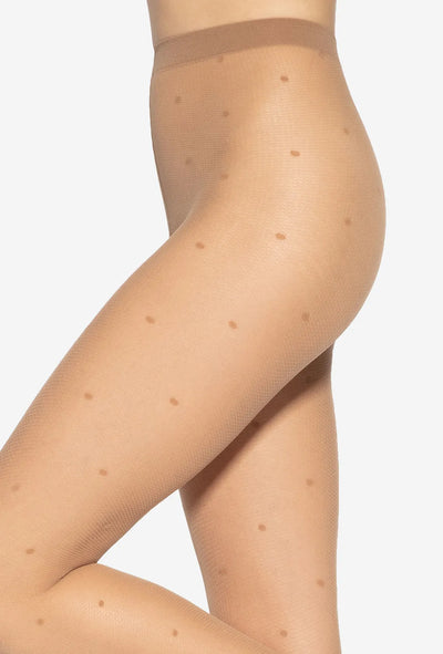 Gatta Funny tan sheer tights, side view showing the dot pattern across the hip and thigh.