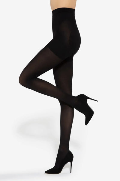 Gatta Bye Cellulite 50 DEN black tights worn with stiletto heels, side view, one leg raised.