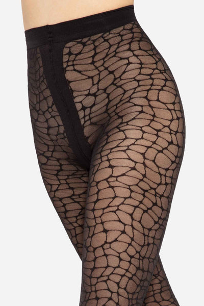 Close-up of the modern patterned tights' crackled net motif across the hip and thigh.