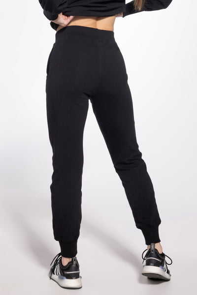 Gatta black sweatpants from behind, showing the plain elastic waist and cuffed ankles.