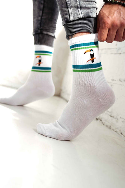 White men's cotton socks with toucan pattern – second side angle showing tropical print placement
