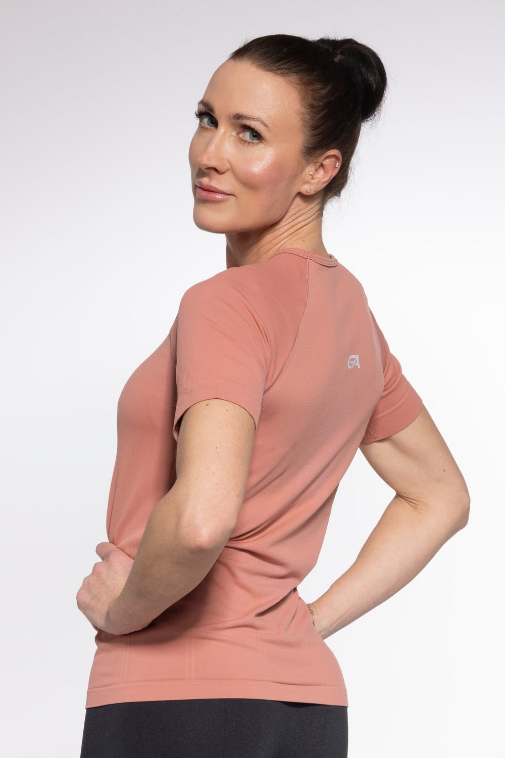 Living Coral activewear T-shirt back view, reflective stripe detail

