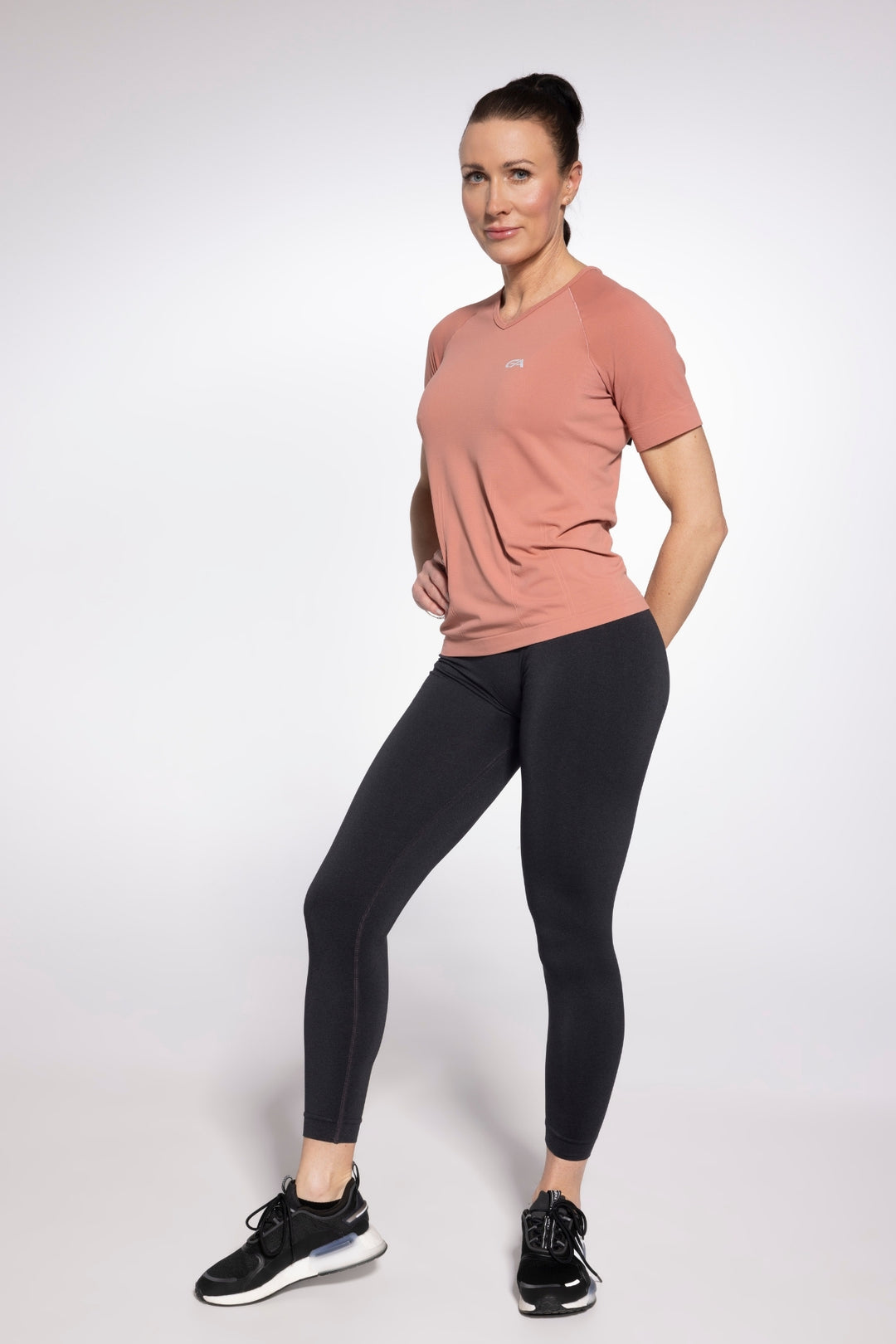 Living Coral quick-dry gym top front view, alternate angle
