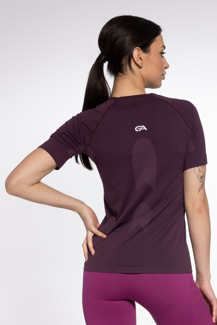 Prugna plum activewear top back view, reflective stripe detail
