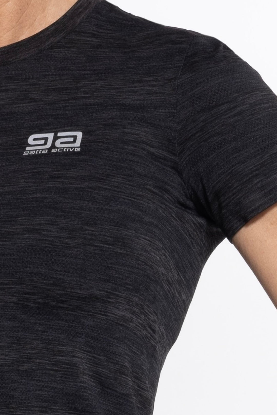 Black women's gym top front close-up, seamless fabric detail
