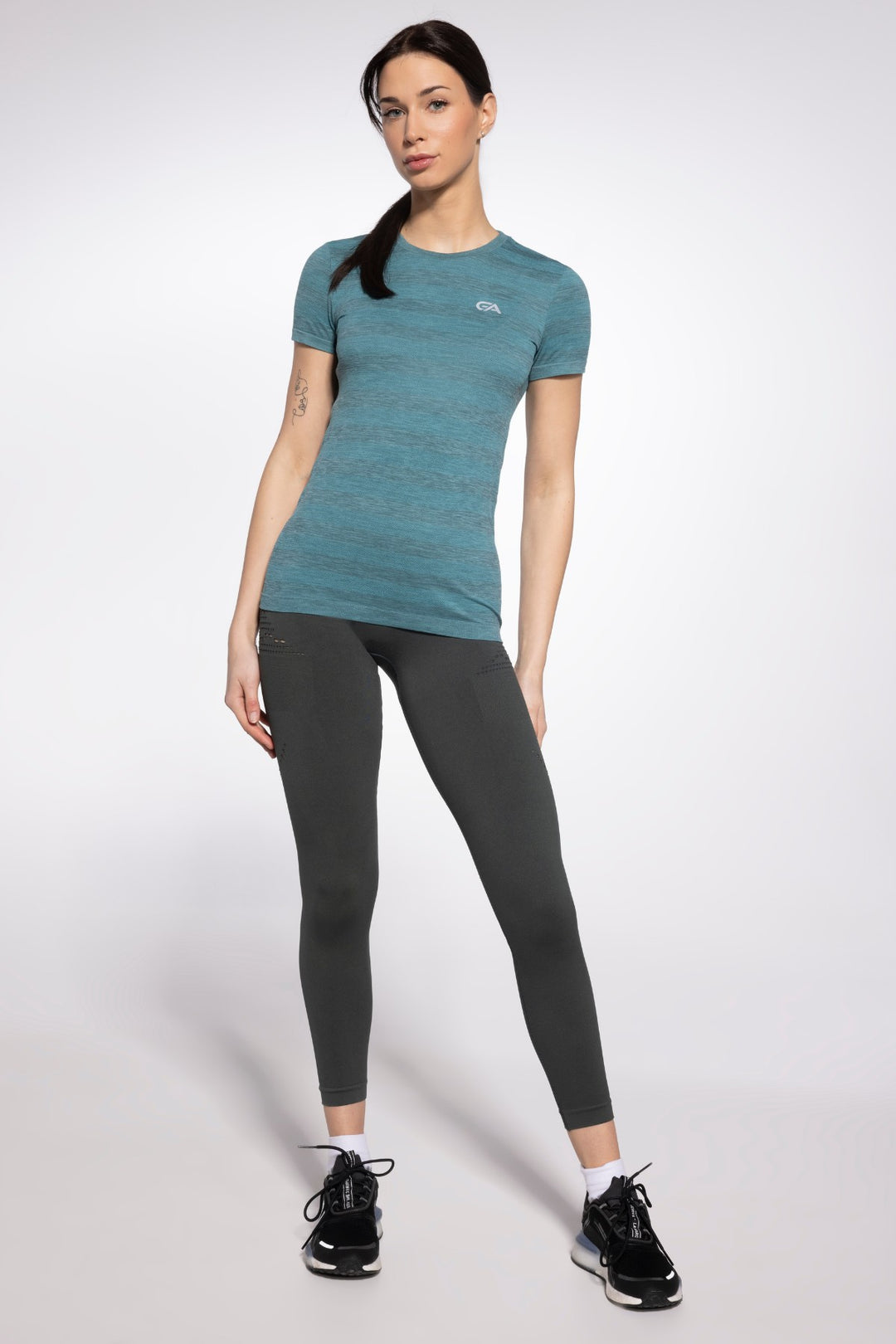 Green seamless sports top front view, full length
