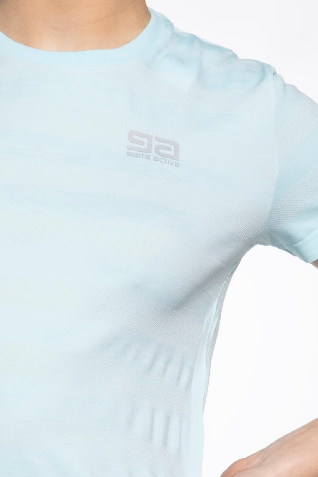 Light blue women's gym top front close-up, breathable fabric detail
