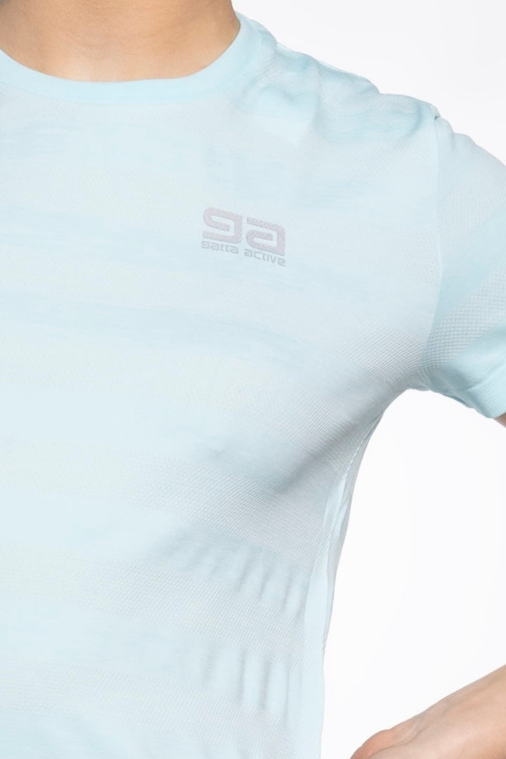 Light blue women's gym top front close-up, breathable fabric detail
