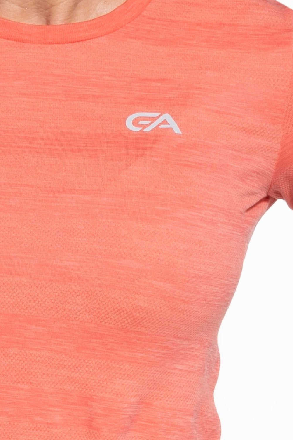 Living Coral gym top front close-up, seamless fabric detail
